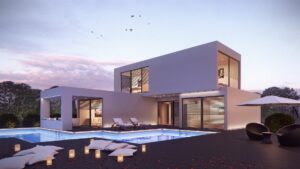 Zweigeschossiges Fertighaus mit Flachdach, großen Glasflächen und Poolterrasse in der Abenddämmerung